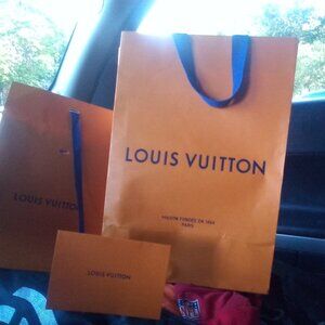 used gift bags from Louis Vuitton and a gift card env or receipt envelope